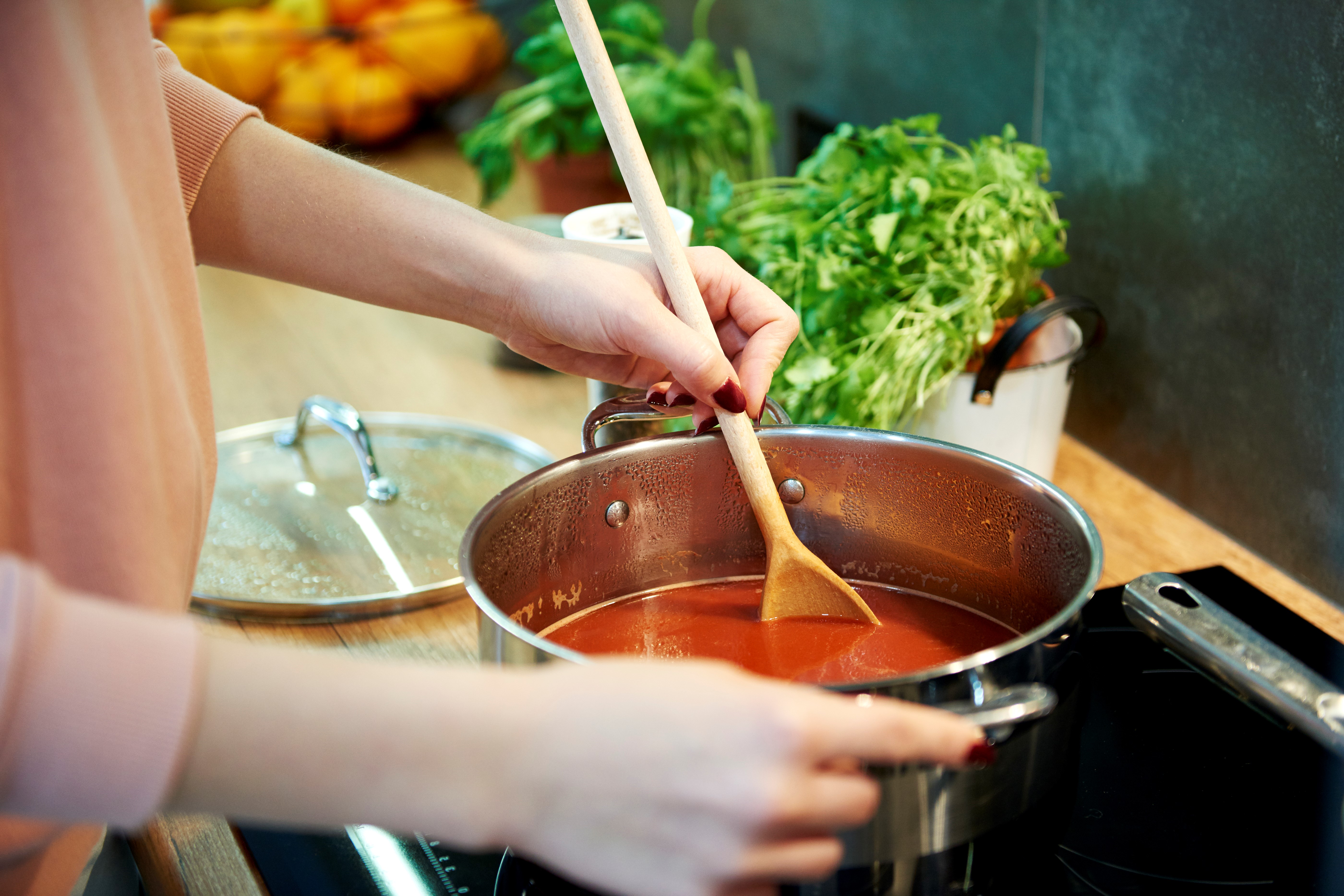 Woman cooking a soup