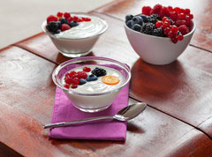 two bowl of white with red and black berries with a bowl of berries
