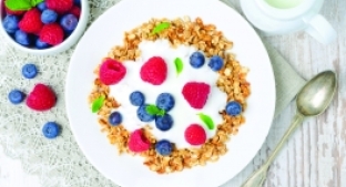 Bowl of fibre cereal with dairy and added fruit
