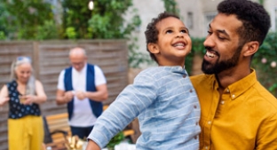 Why people need fibre at every age Smiling son and father with grandparents in the background